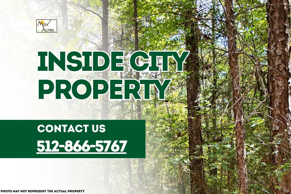 Wooded lot within city limits with text overlay reading "Inside City Property – Contact 512-866-5767" by Max Acres.
